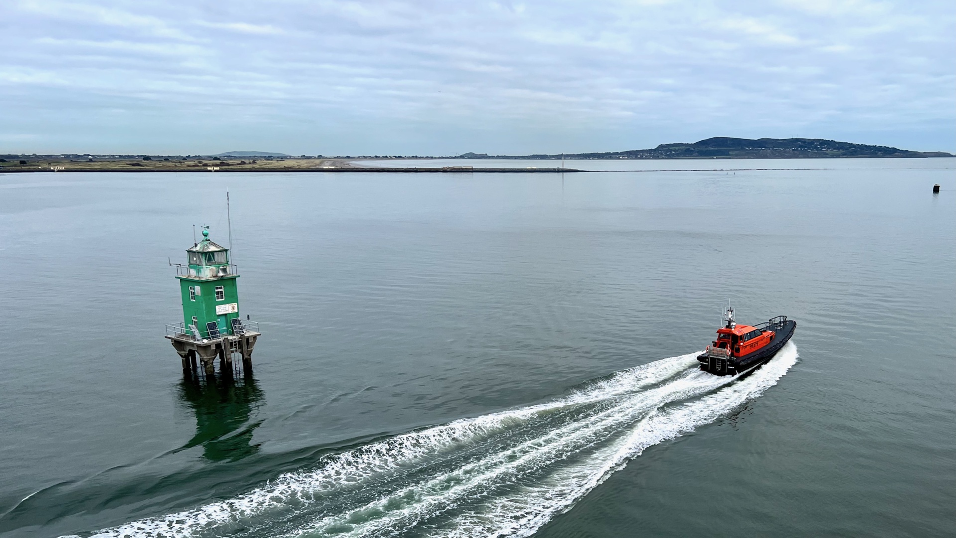 Carousel - Aerial photo of pilot launch leaving port