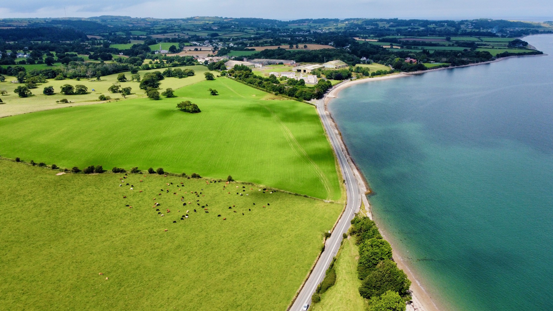 Carousel - aerial photo of green fields by the sea